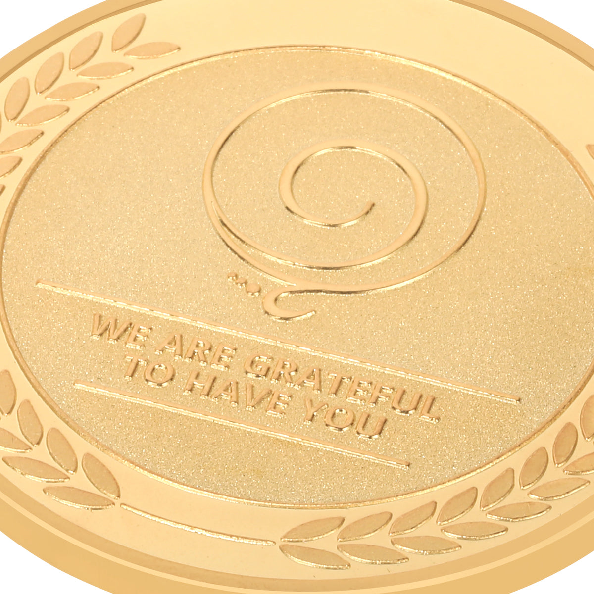 gratitude coin to show appreciation to employees close-up view